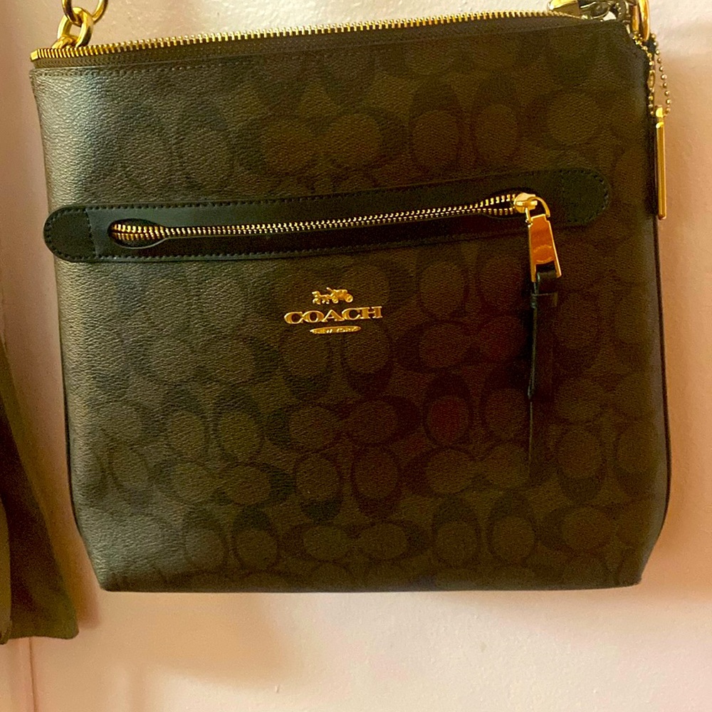 This is a brown and black coach satchel